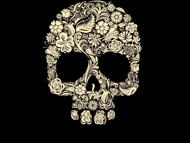 Череп из цветов на черном фоне