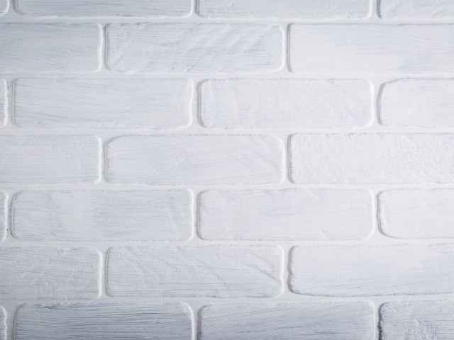 Белая кирпичная стена крупным планом