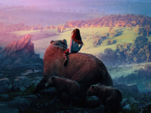 Девочка катается на большом медведе