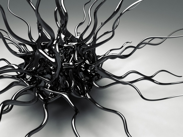 Черный металлический сплав на сером фоне