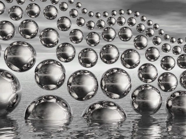 Много стеклянных 3д шаров в полете на сером фоне