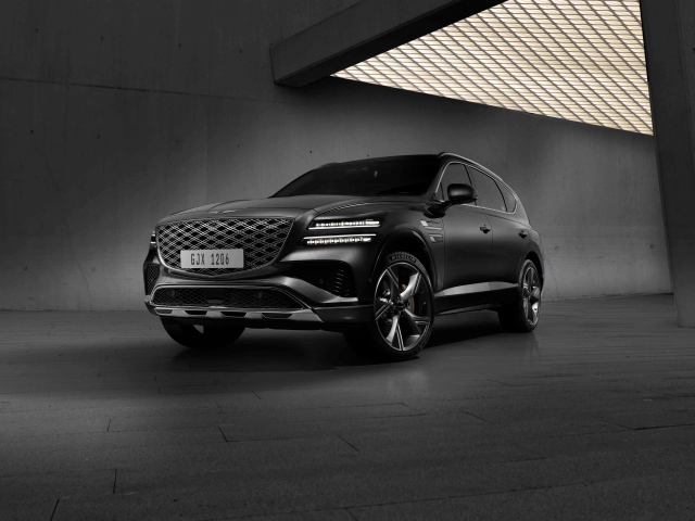 Черный автомобиль  Genesis GV80 AWD в здании