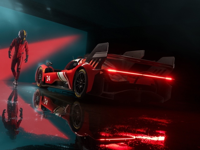 Красный спортивный автомобиль Ferrari 499P Modificata готовится к гонке