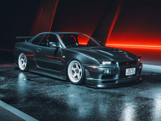 Черный автомобиль Nissan Skyline GTR R34
