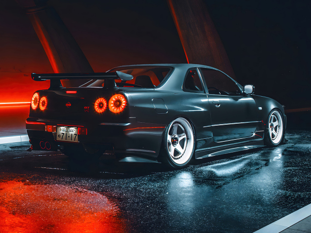 Черный автомобиль Nissan Skyline GTR R35 вид сзади