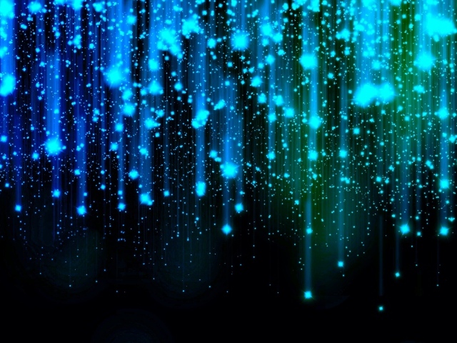 Яркие искры летят вниз на черном фоне