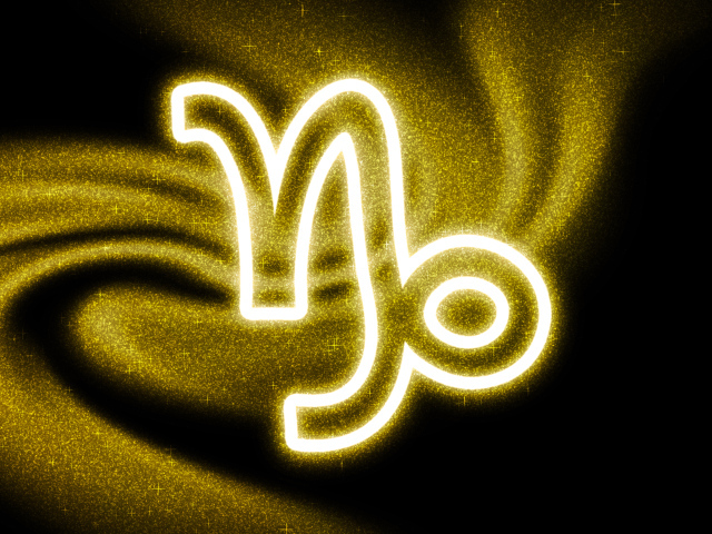 Золотистая пыль со знаком зодиака козерог на черном фоне