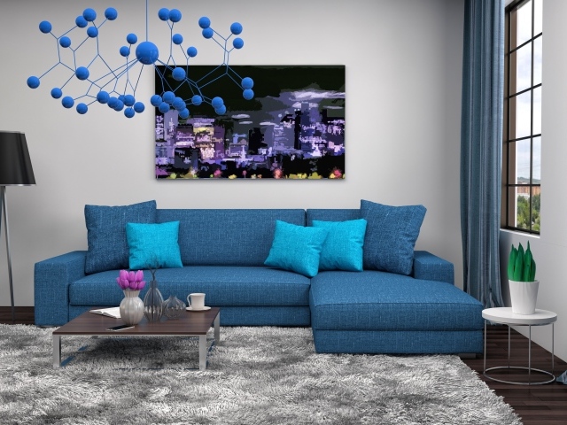 Большой синий диван в комнате в стиле модерн