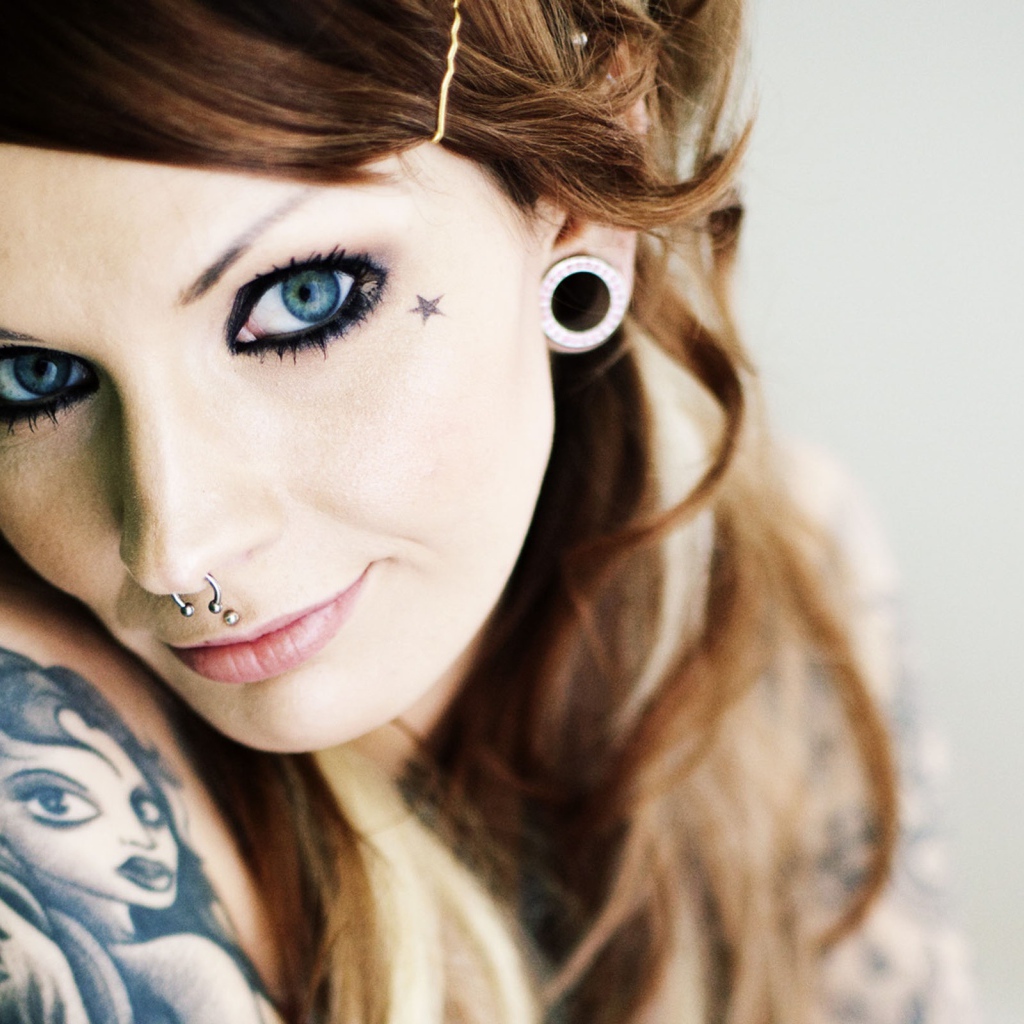 Girl with tattoos and piercings