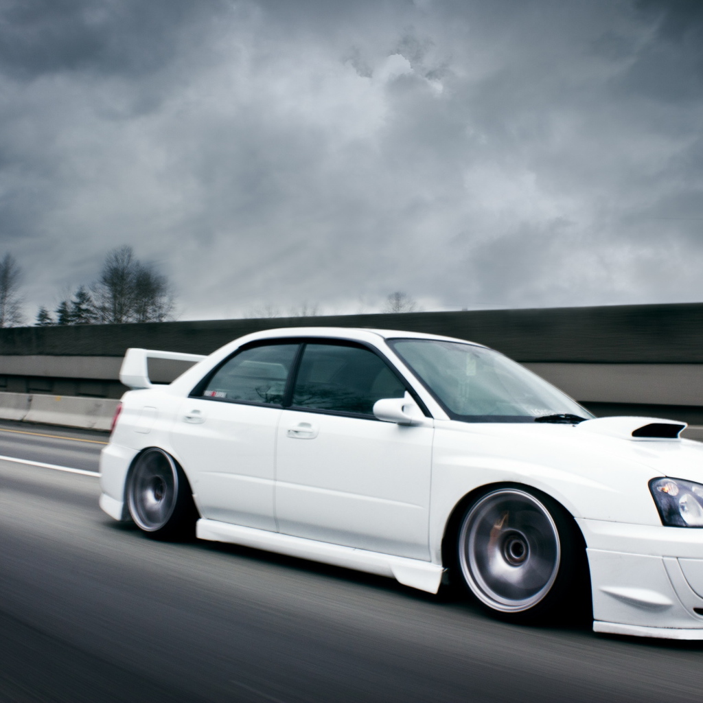 white Subaru Impreza STI