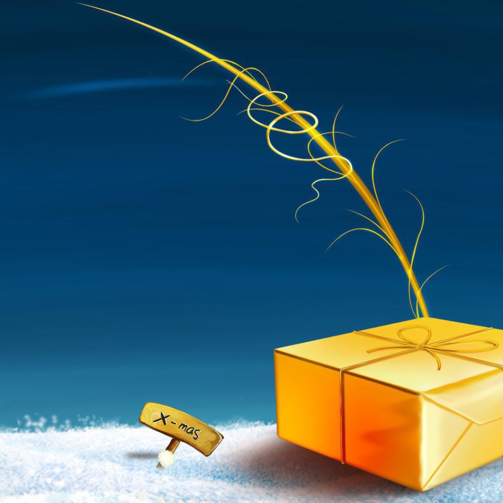 Жёлтая подарочная коробка лежит на снегу на рождество