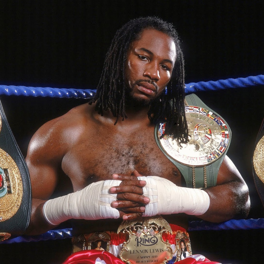 Champion Lennox Lewis and his belts