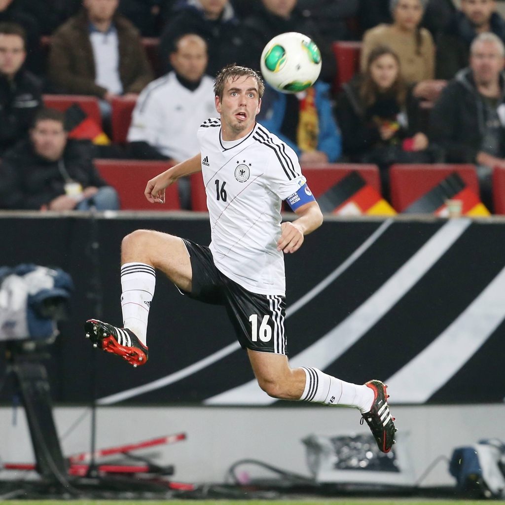 The player of Bayern Philipp Lahm trying to hit the ball