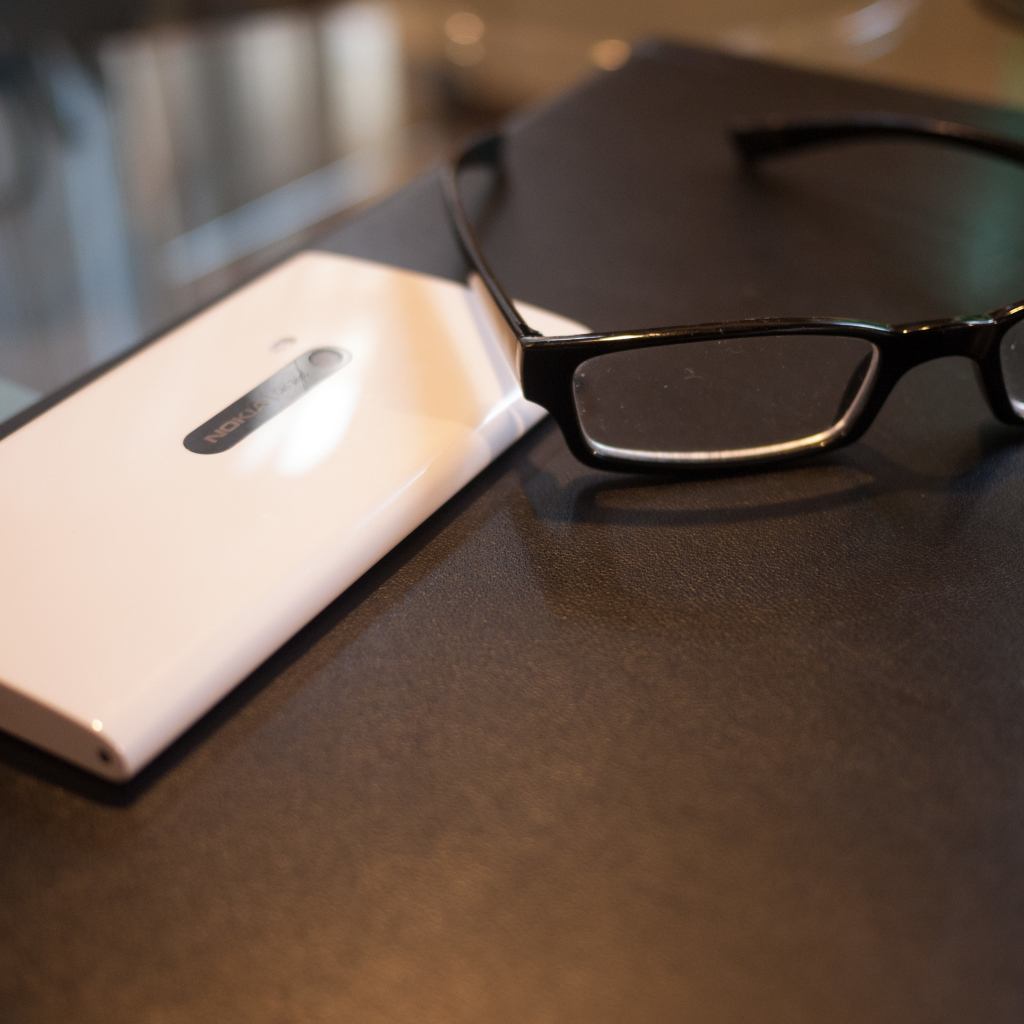 White Nokia Lumia 920 and glasses