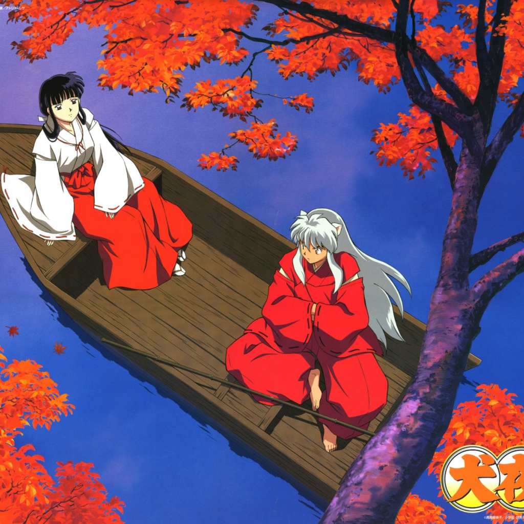 Две девочки в лодке осенью