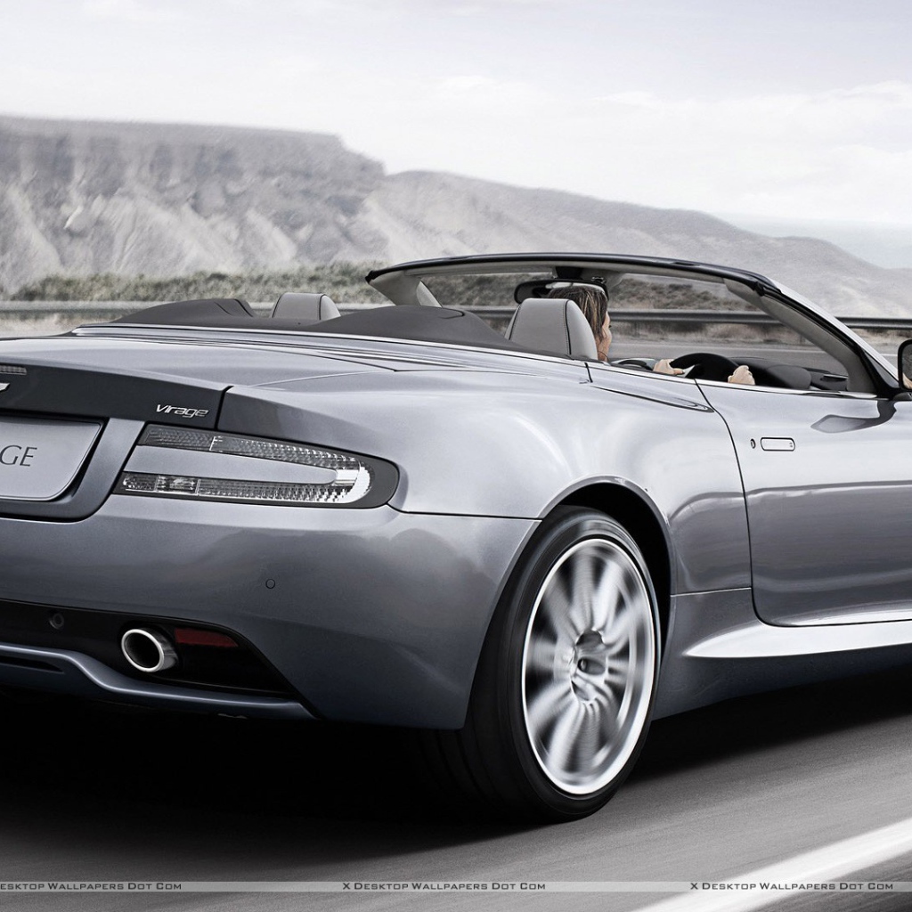 Автомобиль Aston Martin virage на дороге