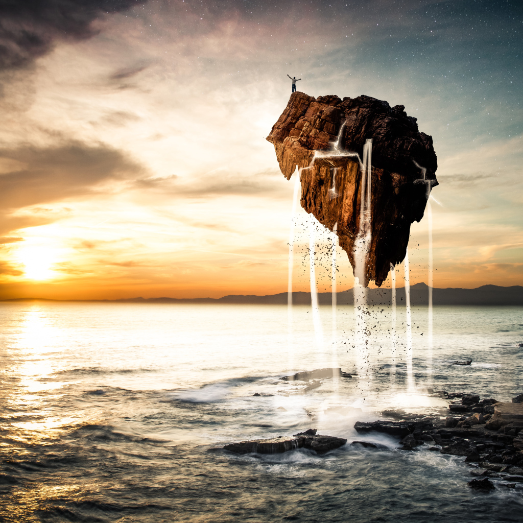 Человек стоит на скале