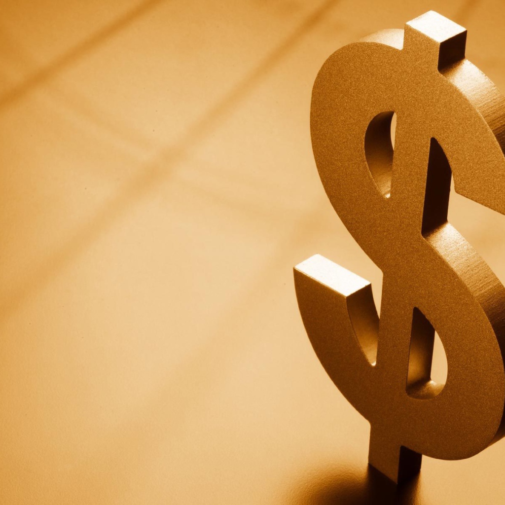 Металлический знак доллара