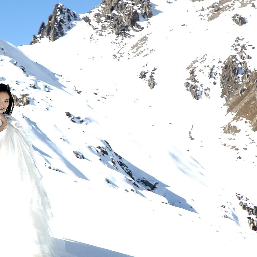The bride in the snowy mountains