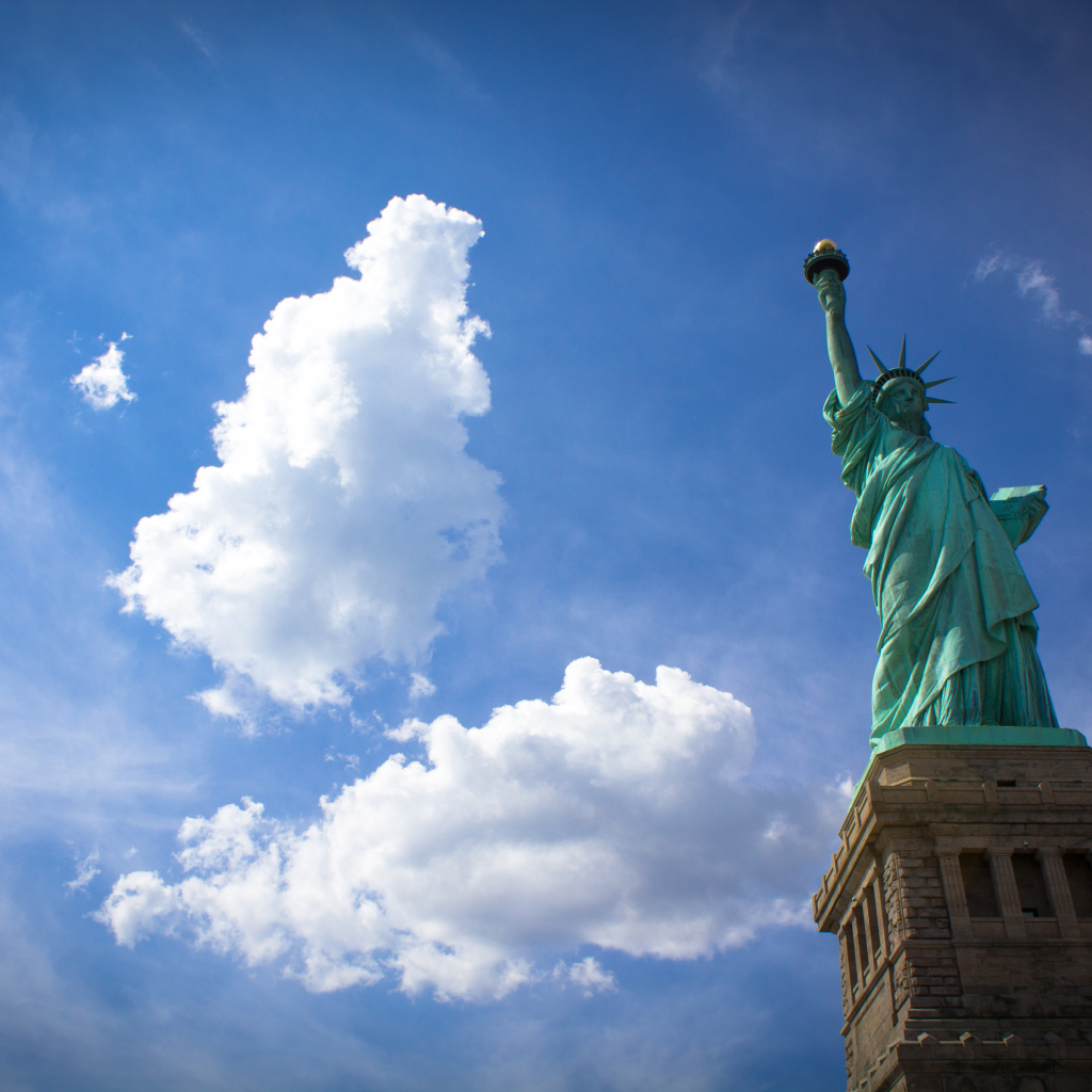Statue of Liberty on the background of clouds, New York, USA