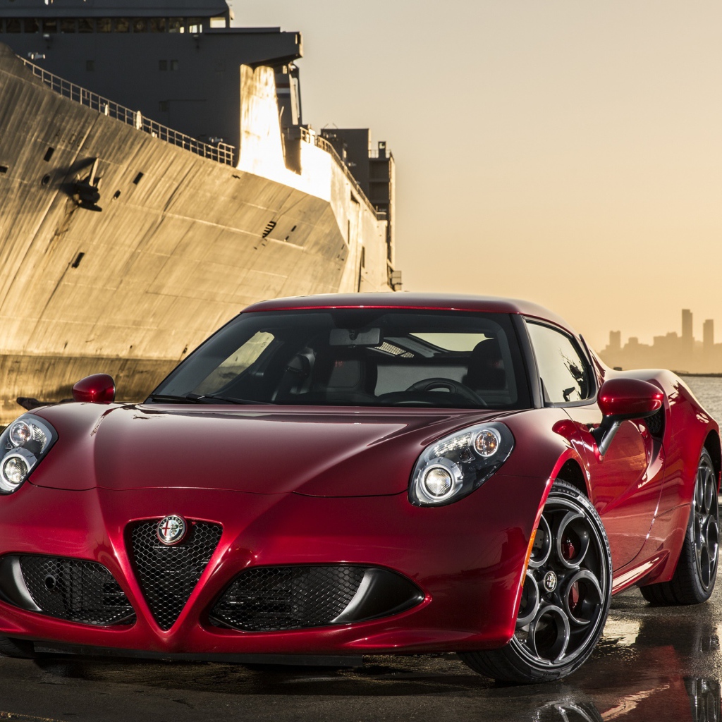 Red Alfa Romeo 4C on the background of the ship