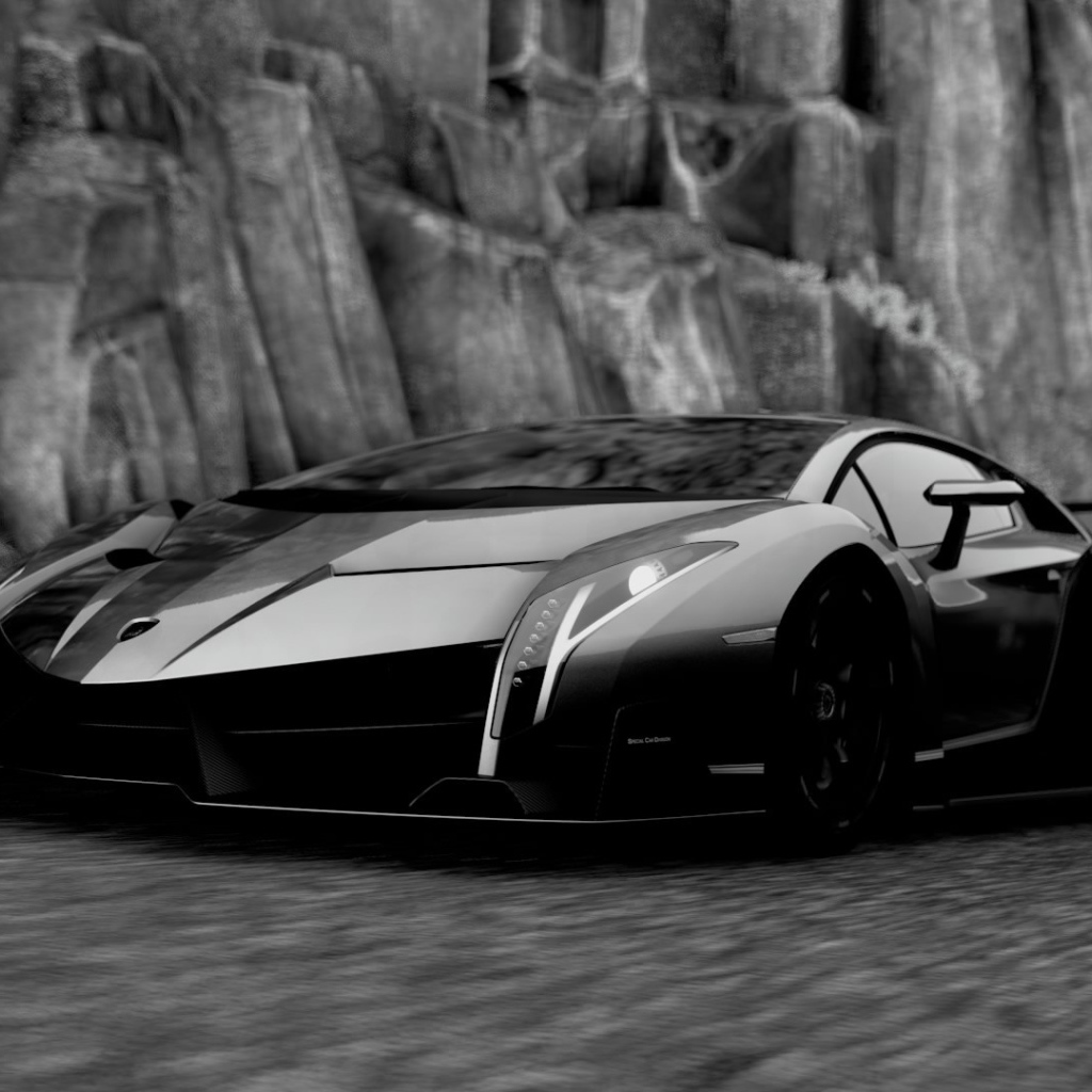 Черный Ламборгини у каменной скалы