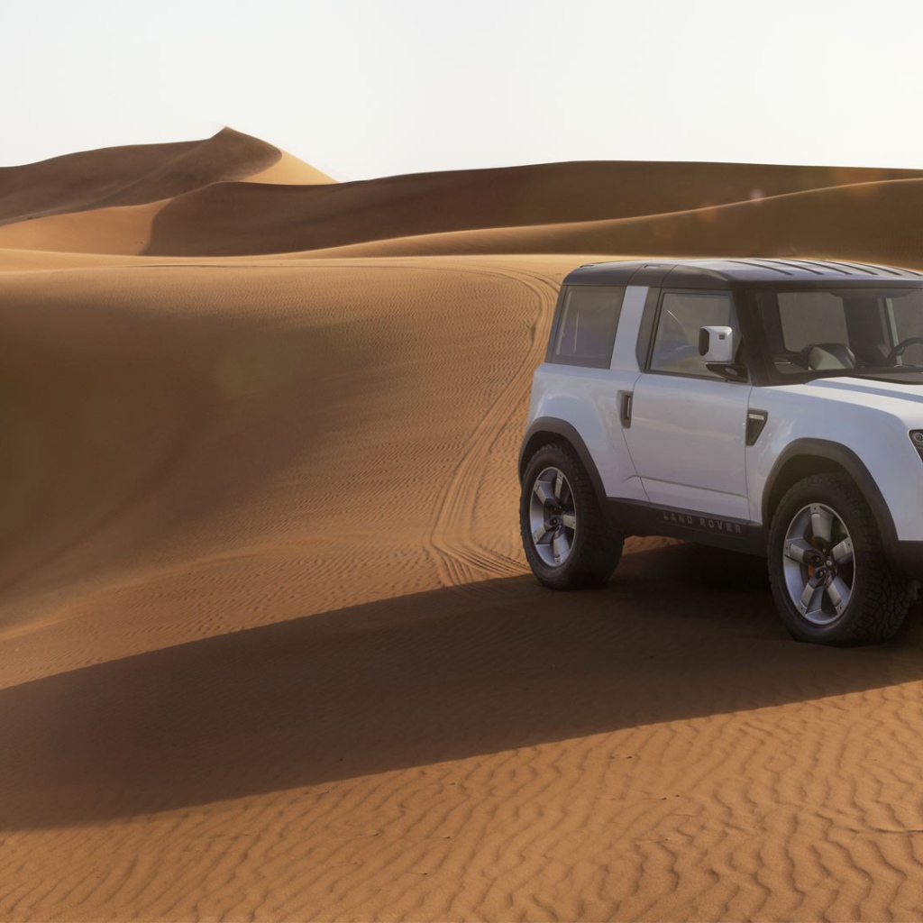 White Land Rover in the desert