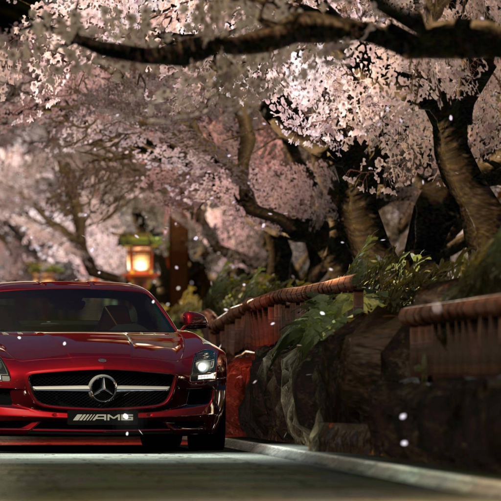 Красный Мерседес Gran Turismo под сенью сакуры