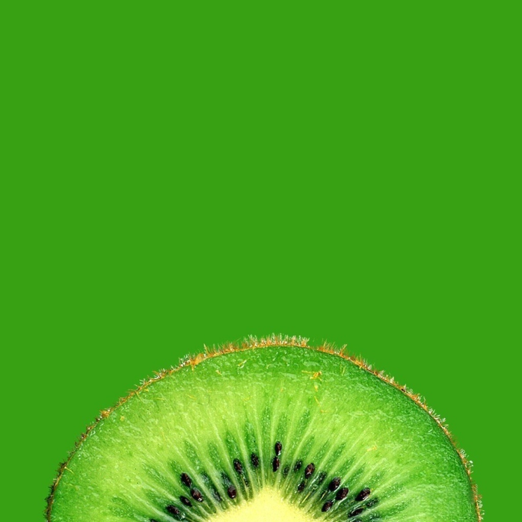 Ломтик киви, зеленый фон