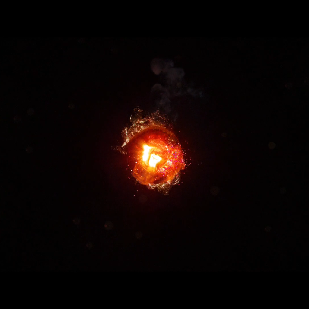 Горящий уголек, черный фон