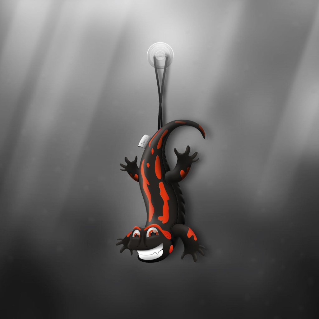 Ящерица игрушка, серый фон