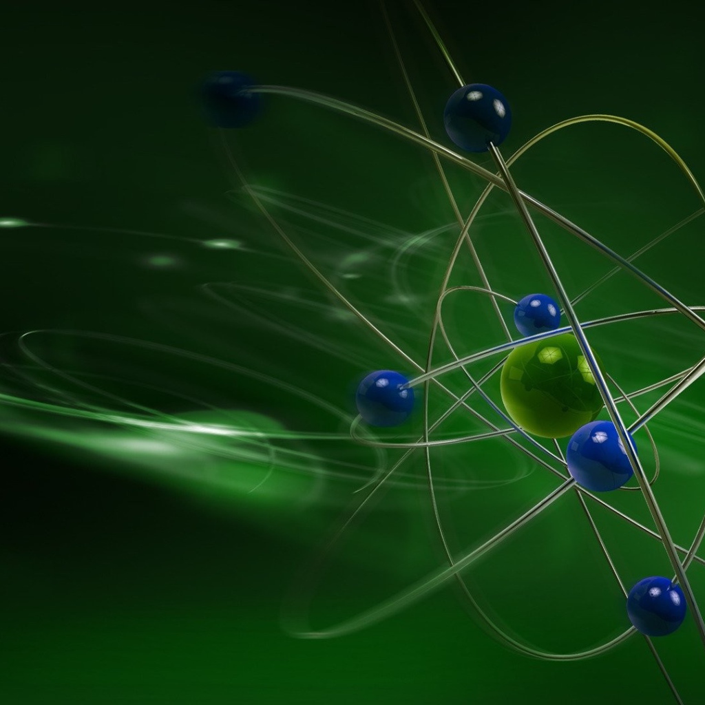 Модель атома на зеленом фоне