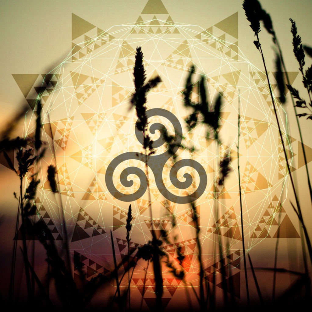 Символ солнца на фоне колосков