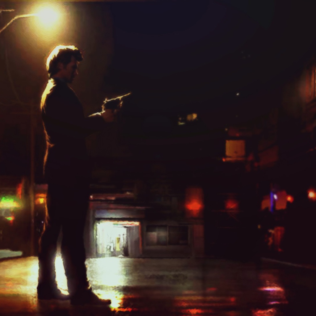 Мужчина с пистолетом на ночной улице