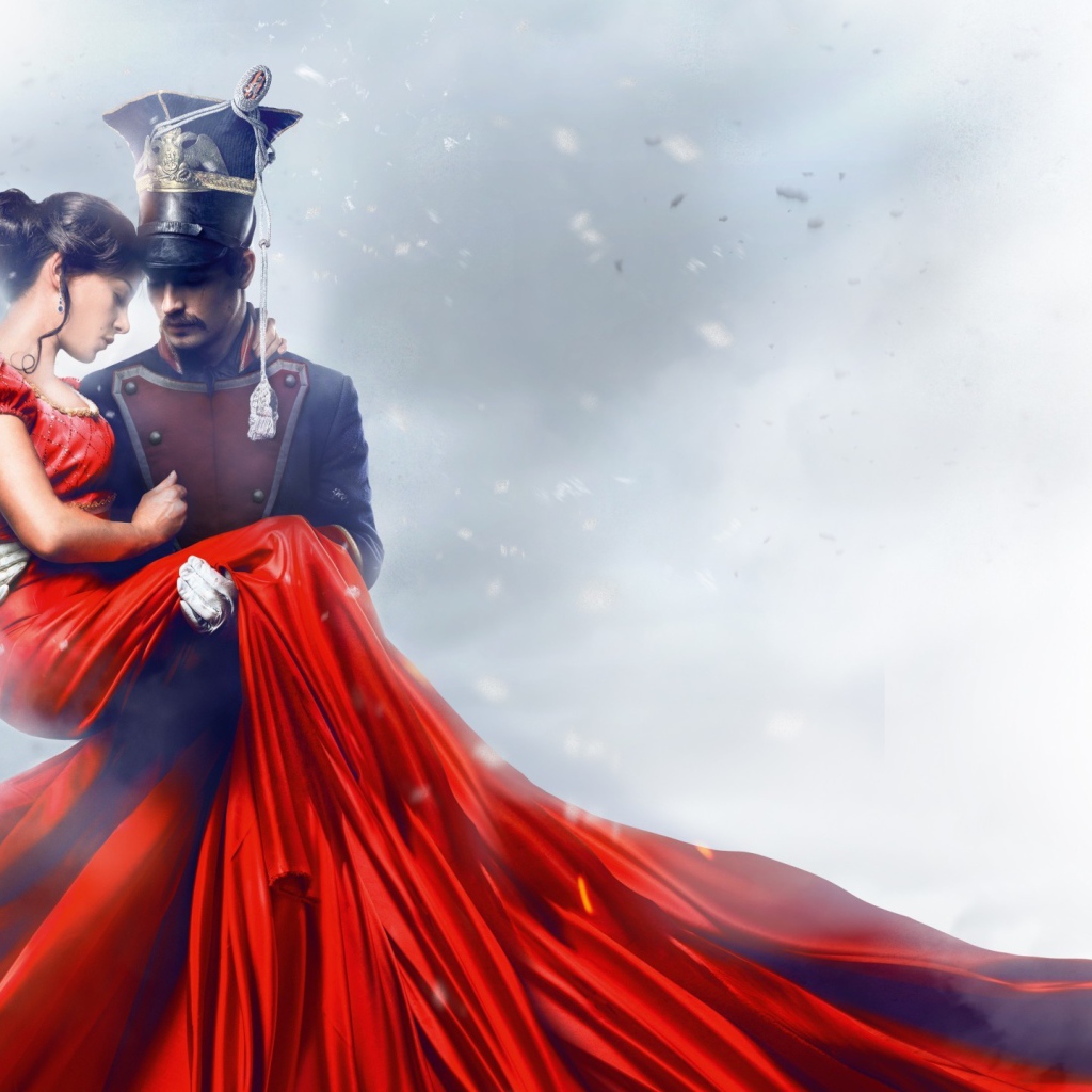 Улан держит на руках девушку в красном платье