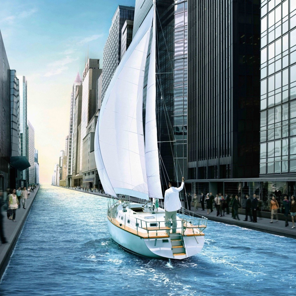 Яхта в канале среди города