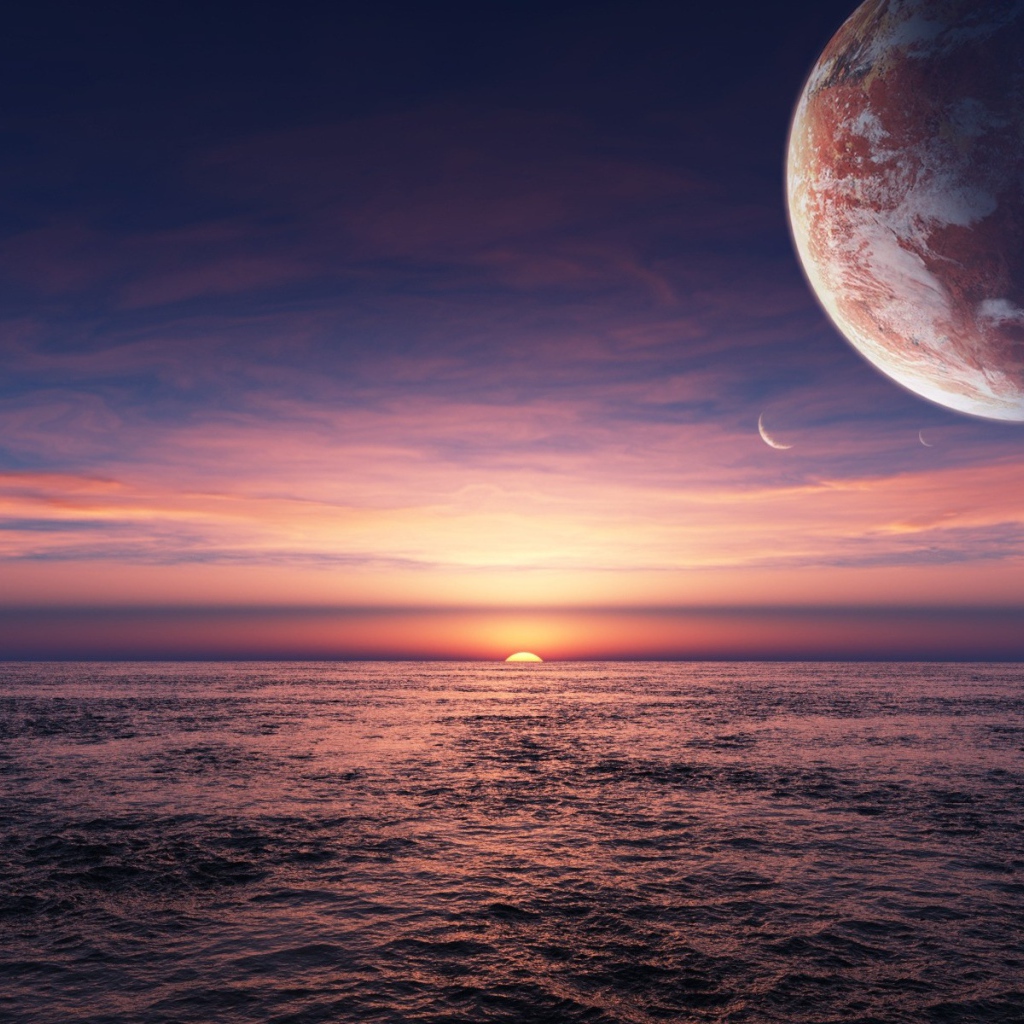 Планета в небе над закатом в океане