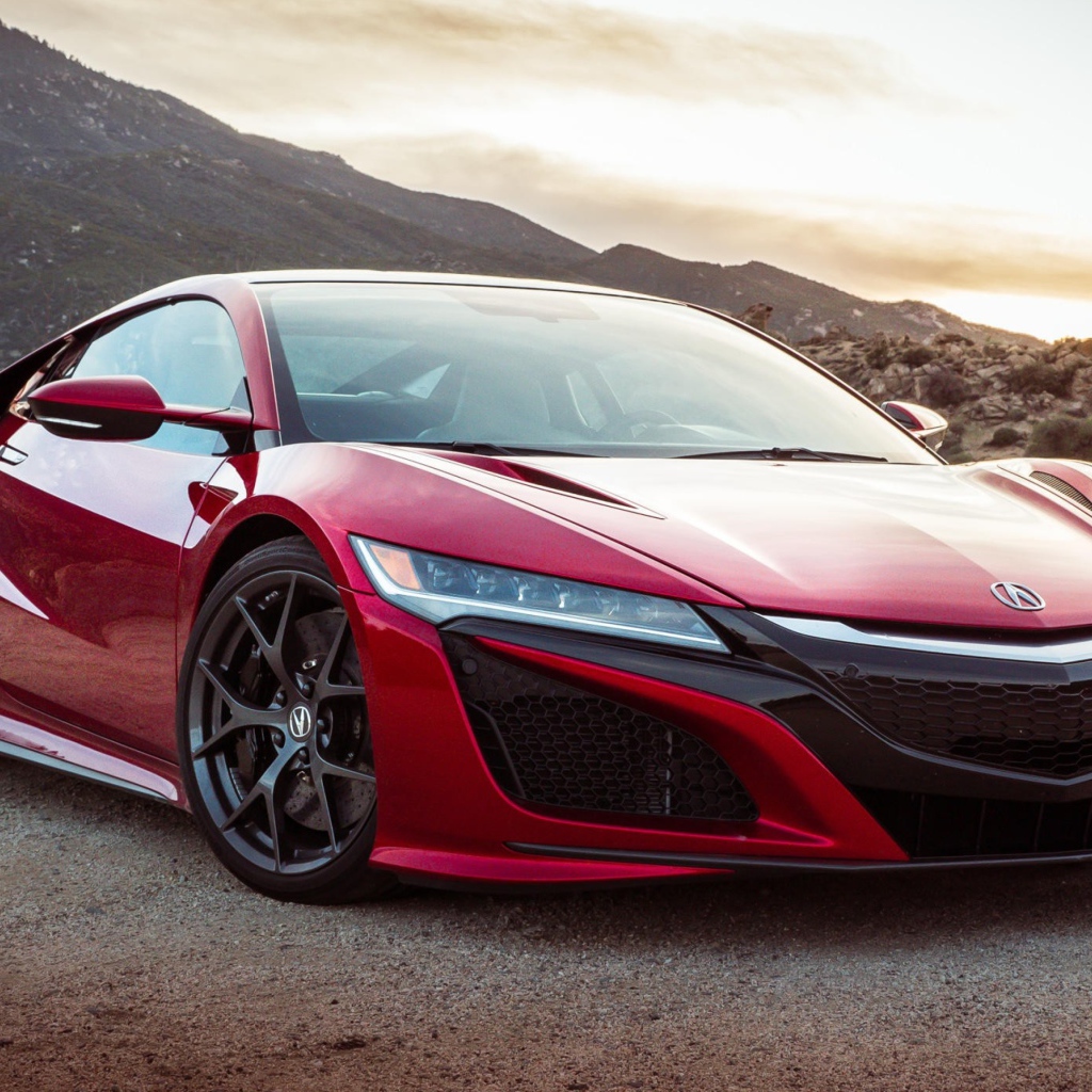 Red car Acura NSX, 2017 amid the mountains