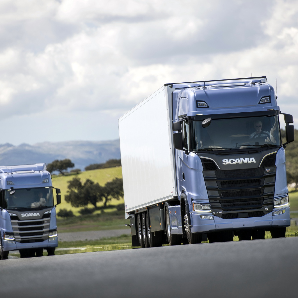 Two blue Scania S 700 trucks on the track