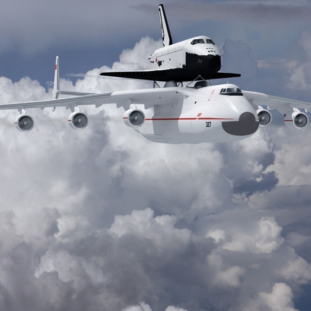 Самолет Ан- 225 Мрия  и ракета носитель «Буран» в на фоне белых облаков 