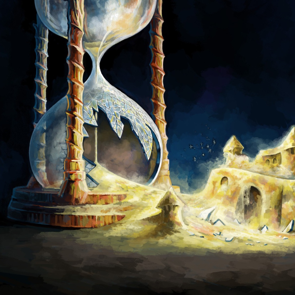 Разбитые песочные часы с замком из песка 