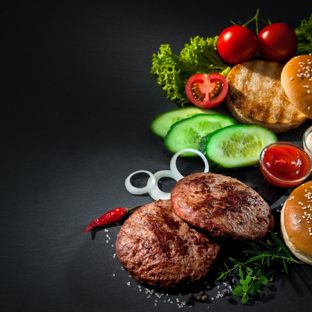 Свежие продукты для гамбургера на сером фоне