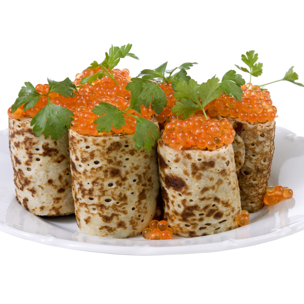 Роллы из блинов с красной икрой на белом блюде