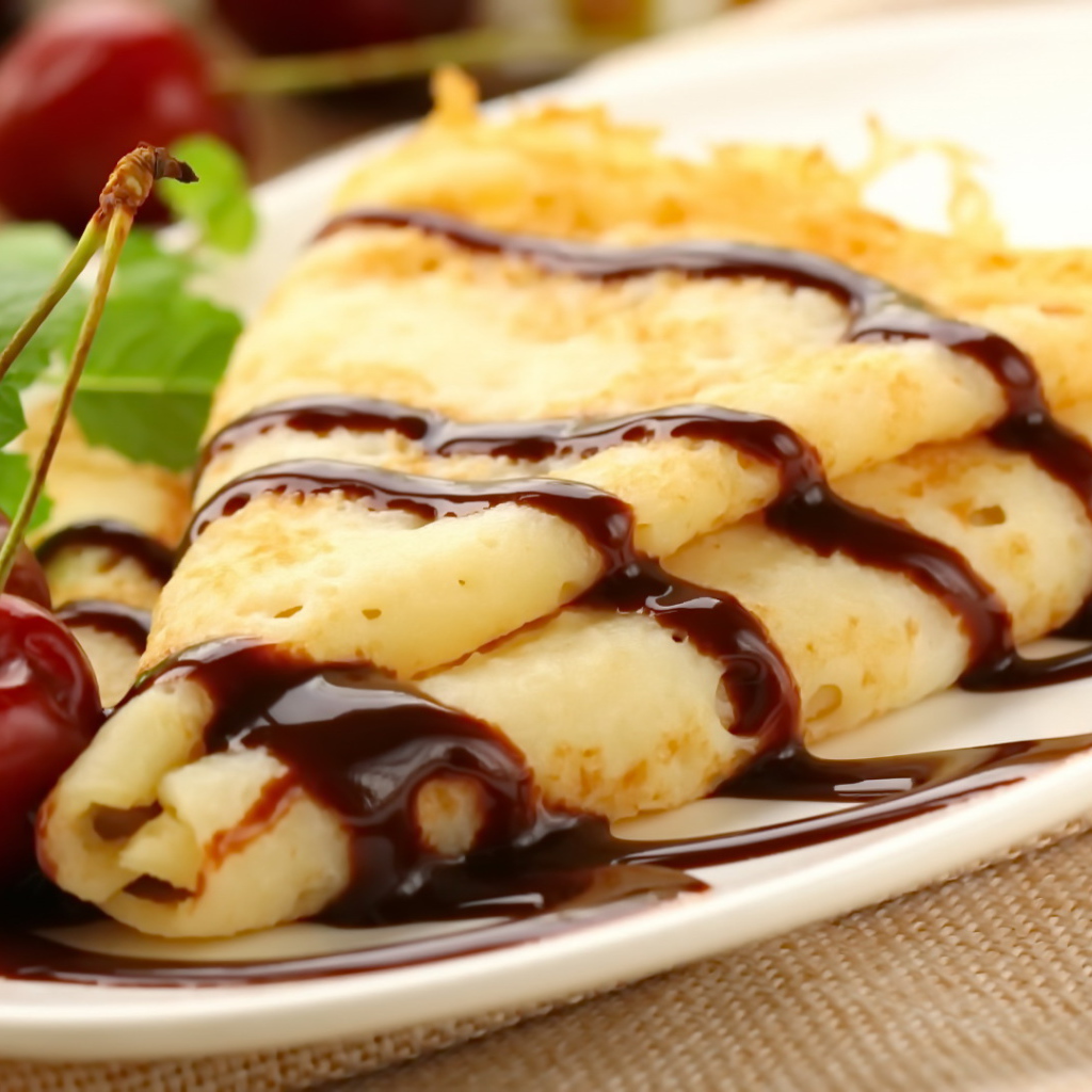Fine pancakes with chocolate and cherries on Shrove Tuesday