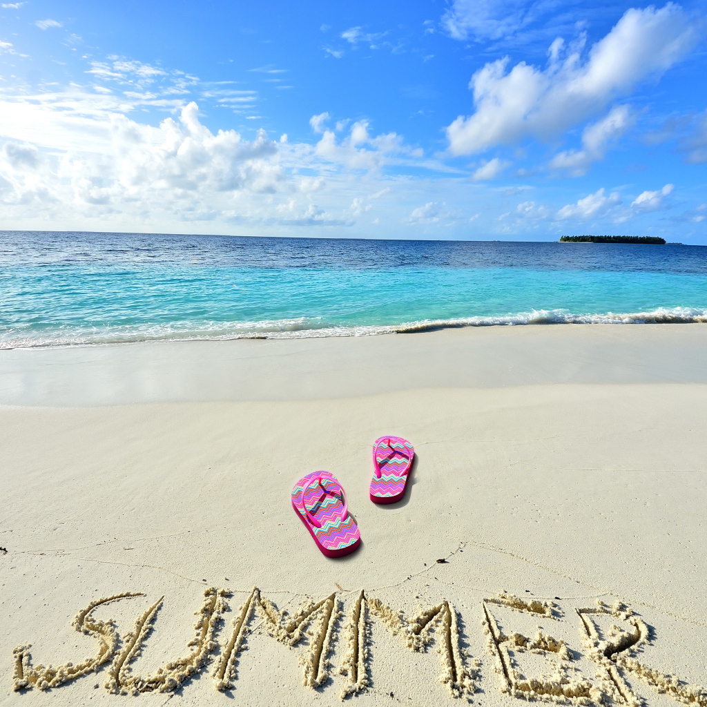 Inscription on warm sea sand in summer