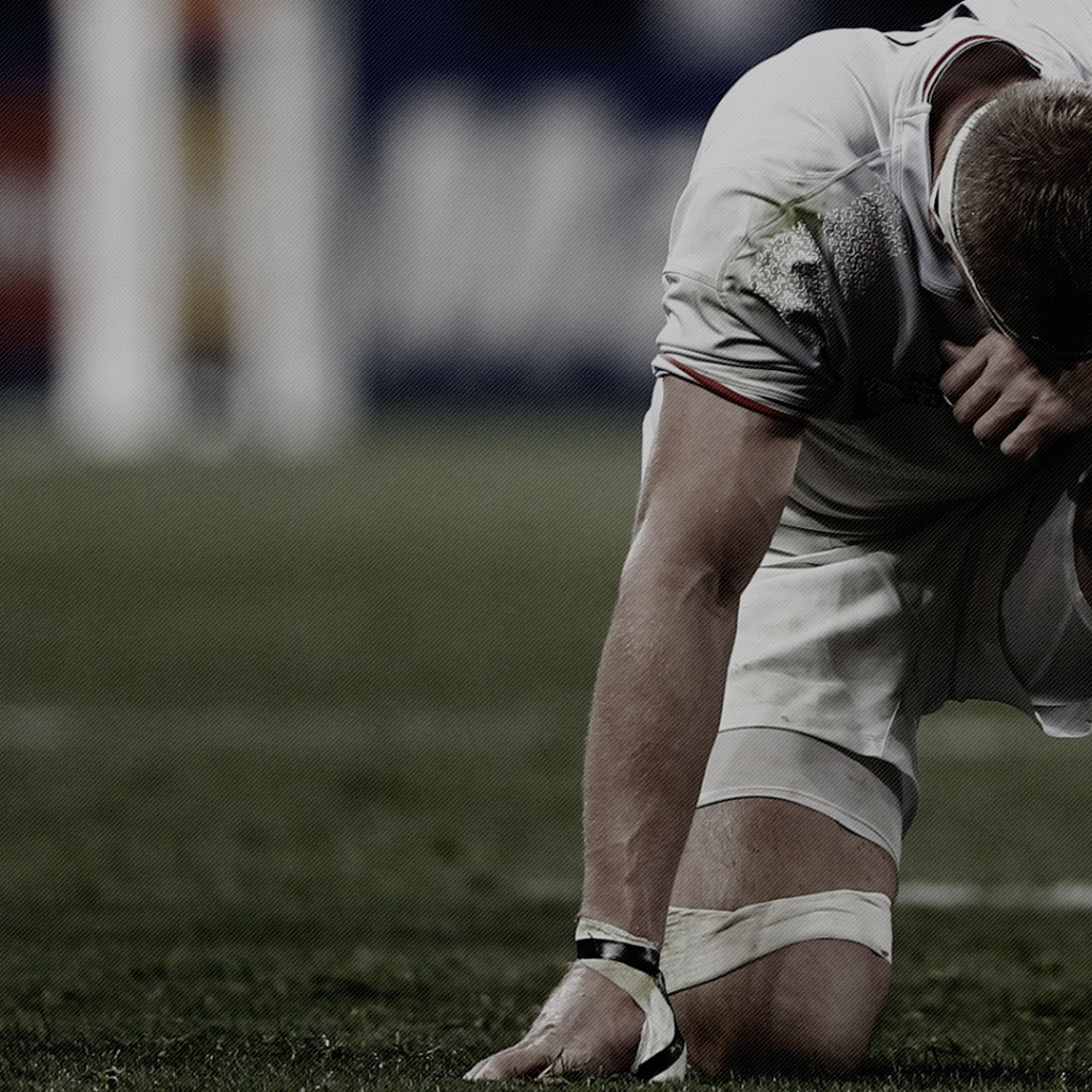 Спортсмен регбист на поле 