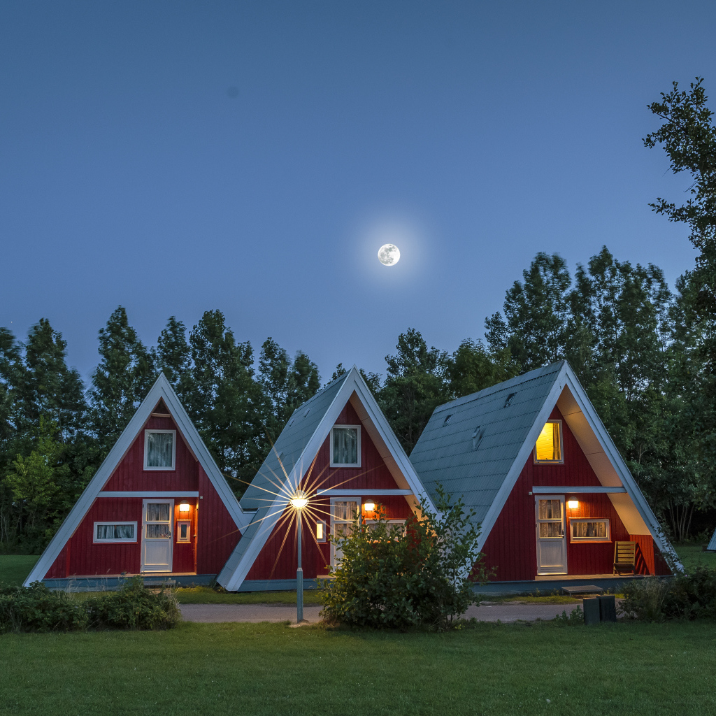 Unusual triangular houses under the night sky, Germany