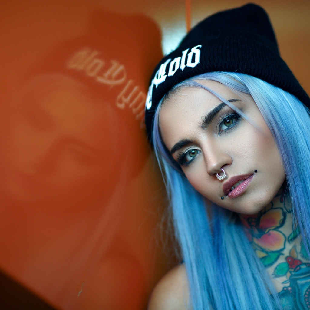 Girl with blue hair and piercing in the nose