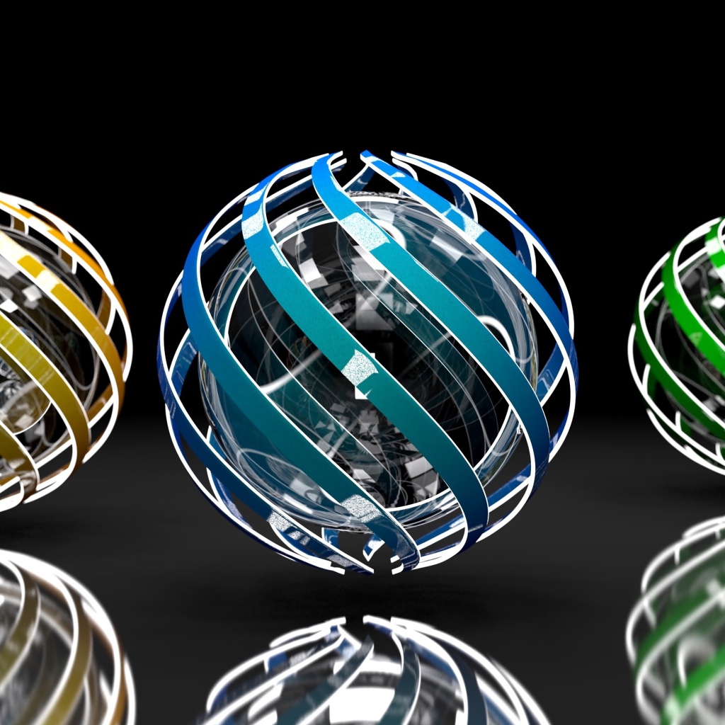 Три разноцветные сферы на сером фоне