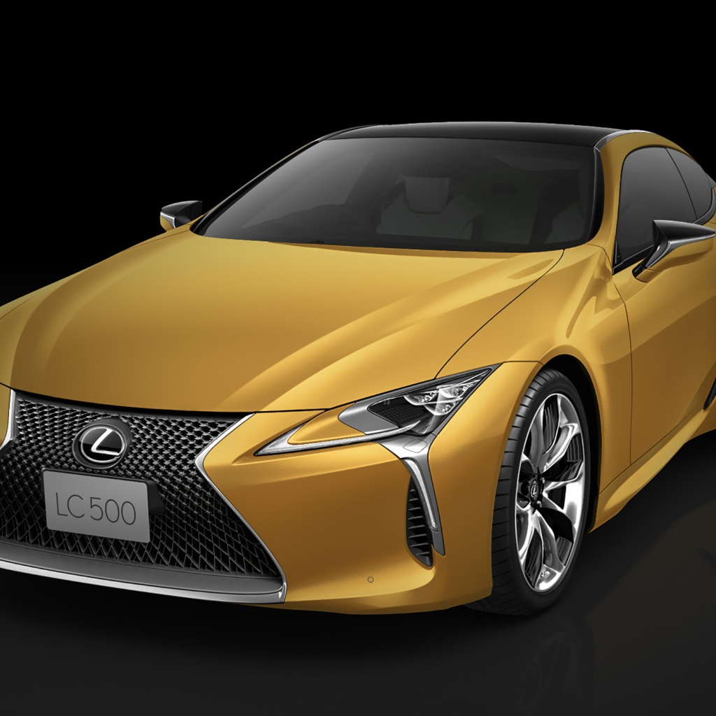 Оранжевый Lexus LC 500 2018 года на черном фоне